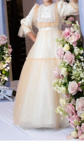 two matching elegant blush children's gowns