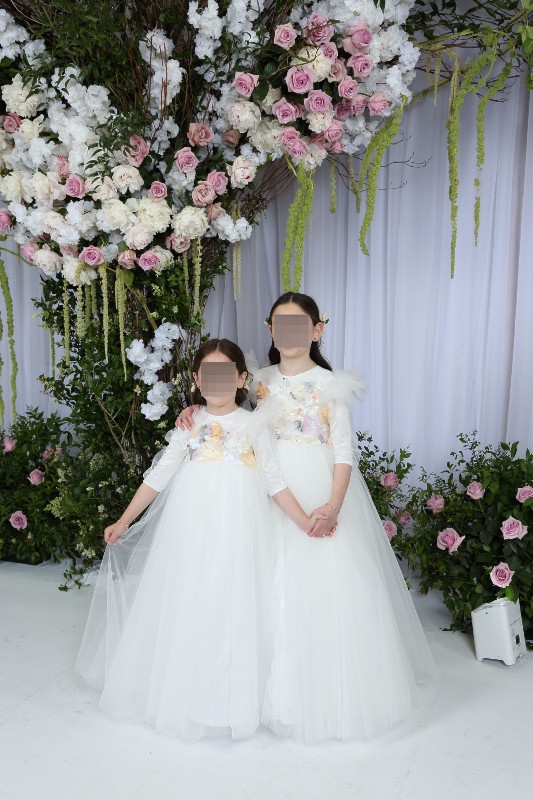 Two matching precious white tulle gowns for sale