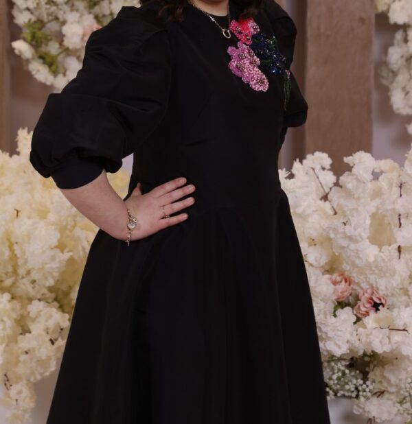 Beautiful black slenderizing gown with stunning colored beading for sale