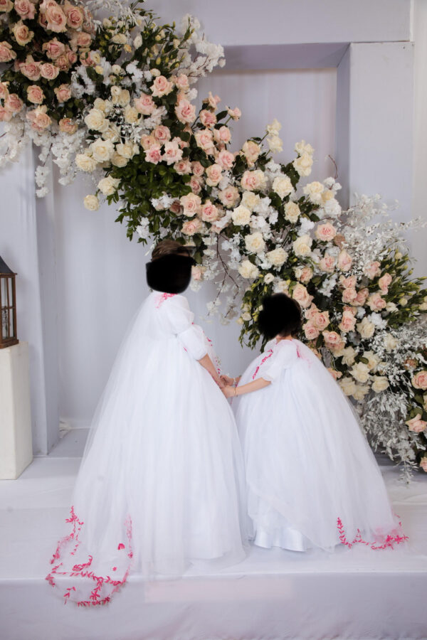 Custom one of a kind little girls white tulle gowns with pink embroidery and bridal train for sale