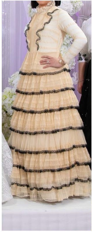 Elegant Valentino off white trimmed in black lace gown for rent