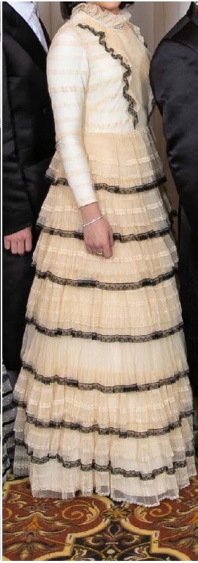 Elegant Valentino off white trimmed in black lace gown for rent