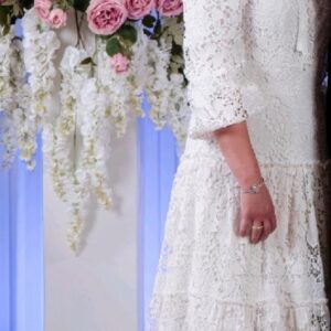 Magnificent white eyelet Miri gown for rent