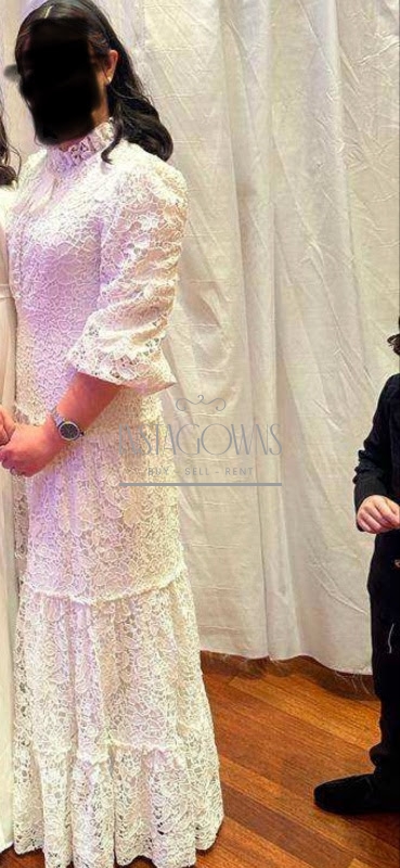 Magnificent white eyelet Miri gown for rent