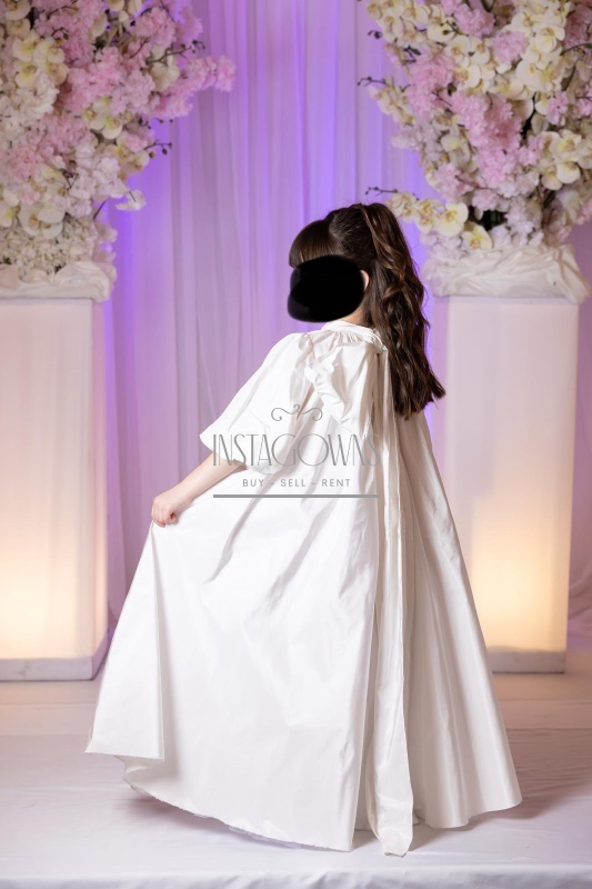 Beautiful custom off white children’s gowns for rent