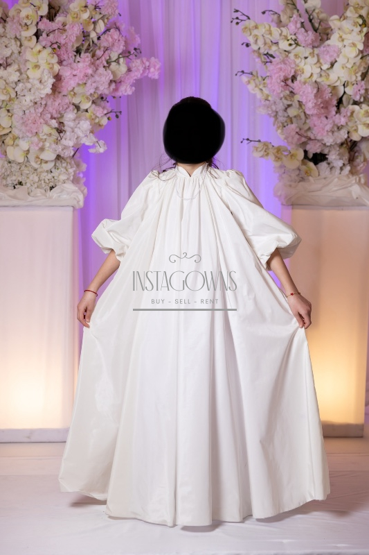 Beautiful custom off white children’s gowns for rent