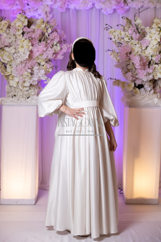 Beautiful custom off white children’s gowns for rent