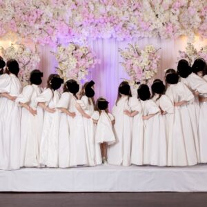 Beautiful custom off white children’s gowns for rent