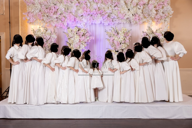 Beautiful custom off white children’s gowns for rent