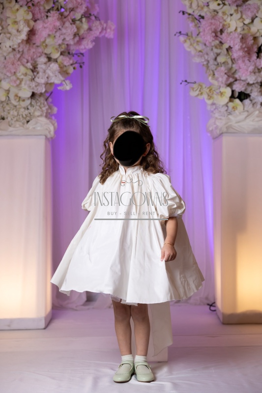 Beautiful custom off white children’s gowns for rent