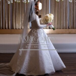 Stunning White Bridal Gown with boning, buttons and a cathedral veil for sale or rent