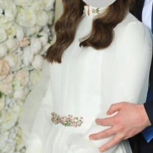Elegant white gown with intricate beading for rent