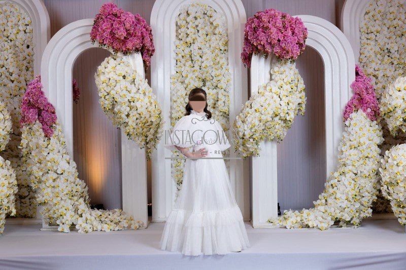 Beautiful coordinating white tulle gowns with pastel floral embroidery for sale