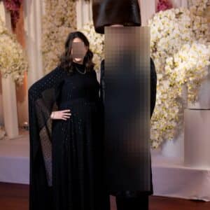 Magnificent black gown with long sash from neck down