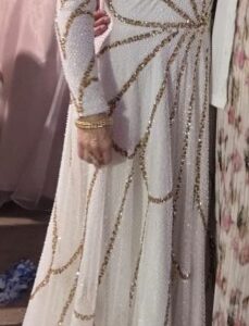 Attractive, fine white & Gold couture gown for sale or rent